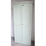 A Victorian painted pine two-door linen press with fitted interior of adjustable shelves,