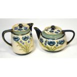 Macintyre & Co; a Florian ware teapot decorated with blue poppies,