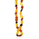 An amber coloured bead necklace.