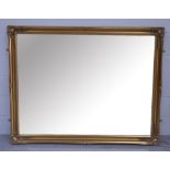 A large modern rectangular gilt framed bevel edge wall mirror, width 137cm.