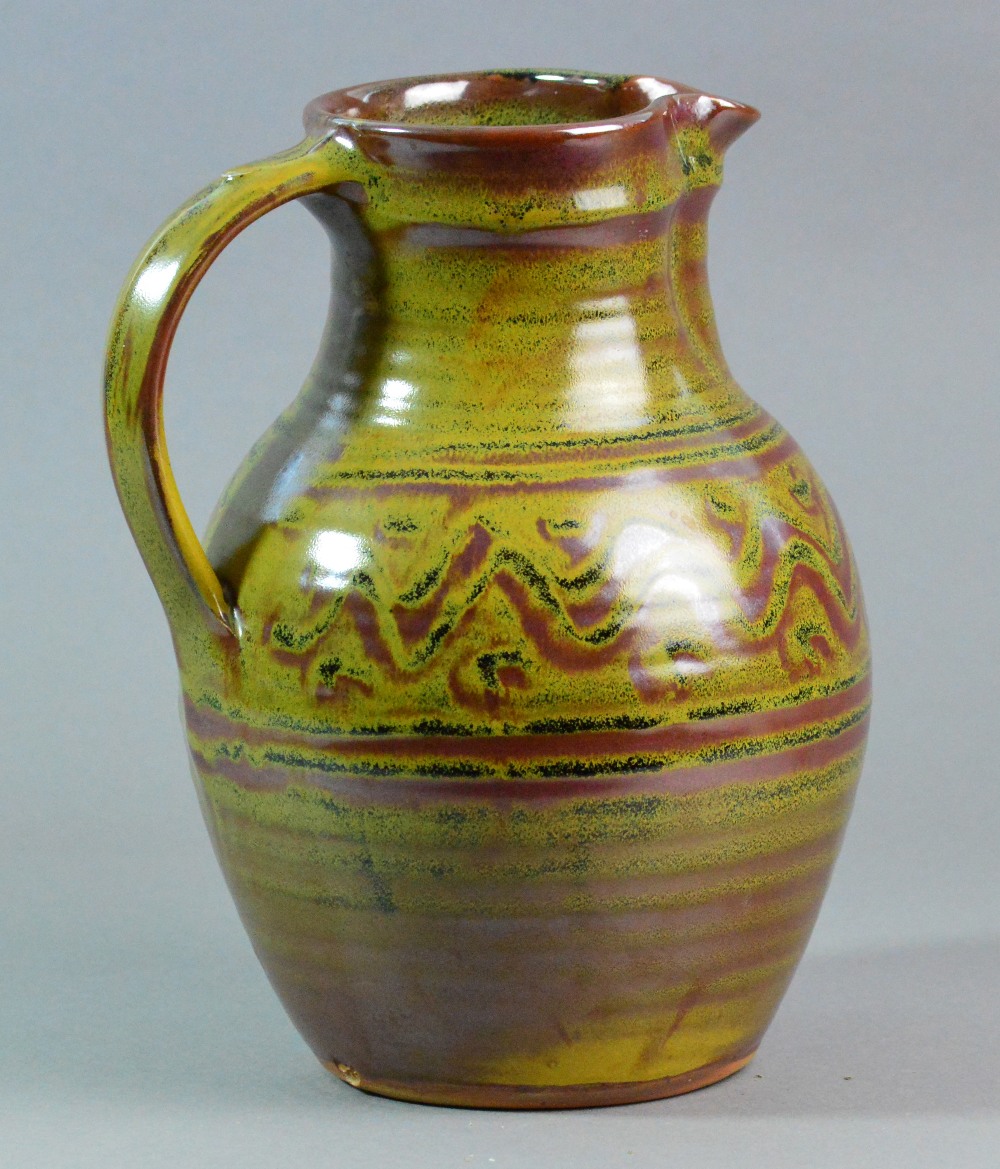 RAY FINCH (1914-2012) for Winchcombe Pottery; a stoneware jug covered in kaki glaze,