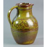 RAY FINCH (1914-2012) for Winchcombe Pottery; a stoneware jug covered in kaki glaze,