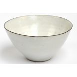 LUCIE RIE (1902-1995); a stoneware bowl covered in off white glaze with manganese rim,