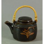 DAVID LEACH (1911-2005) for Lowerdown Pottery; a stoneware teapot with cane handle,