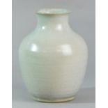 CONSTANCE DUNN; a stoneware vase covered in grey breaking to duck egg blue glaze,