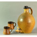 Lowerdown Pottery; a stoneware cider flagon and two mugs,