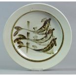 RAY FINCH (1914-2012) for Winchcombe Pottery; a stoneware dish decorated with leaping fish,