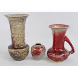 Three pieces of mottled flambé glaze Ruskin including a large vase with everted rim,