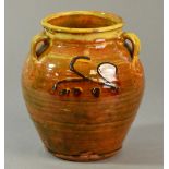 Winchcombe Pottery: an early slipware vase with three lug handles covered in a rich treacle yellow