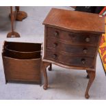 A reproduction mahogany three-drawer chest raised on cabriole supports,