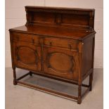 An early 20th century oak sideboard,