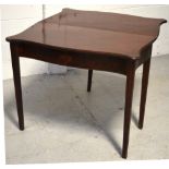 A late Regency mahogany fold-over tea table with inlaid shell motif, width 88cm.