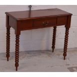 A reproduction mahogany single drawer side table raised on bobbin turned legs, width 90cm.