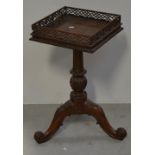 A reproduction occasional table on tripod support with pierced gallery top, width approx 35cm.