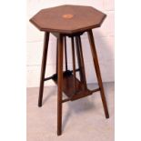 An Edwardian octagonal inlaid side table with lower shelf on splayed supports, height 70cm.