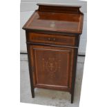 An Edwardian mahogany and inlaid music cabinet,