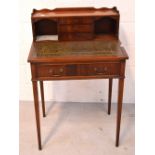 A reproduction mahogany ladies' bureau with green leather insert to top,