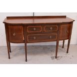 An Edwardian mahogany and inlaid sideboard, two short drawers above long lower drawer,