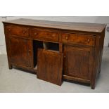 An 18th century country sideboard in oak,