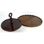 A 20th century stained beech Lazy Susan and a yew wood tray (af) (2).