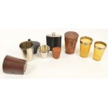 A pair of Victorian horn silver mounted stacking beakers contained within leather outer case,