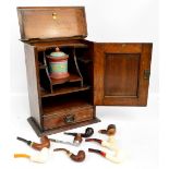 An early 20th century Art Nouveau smoker's cabinet with detailed copper plaque,