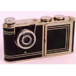 A 1950s West German "Petie" vanity camera with marbled green effect body, camera section,