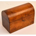 A Victorian walnut tea caddy of rectangular form with domed hinged lid enclosing two lidded