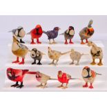 A group of fourteen painted carved bone models of birds, various sizes, each approx 8/9cm long.
