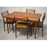 A retro G-Plan teak extending dining table and a set of four ladder back chairs (5).