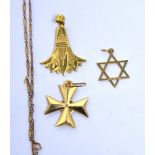 A 9ct gold star pendant, an 18ct gold cross,