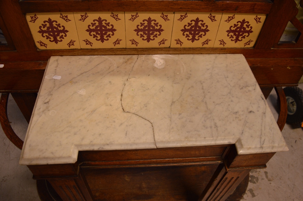 An Edwardian oak Arts and Crafts style hall stand, central mirror above marble top, - Image 2 of 2