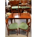 A G-Plan style teak extending dining table, raised on square section tapering legs,