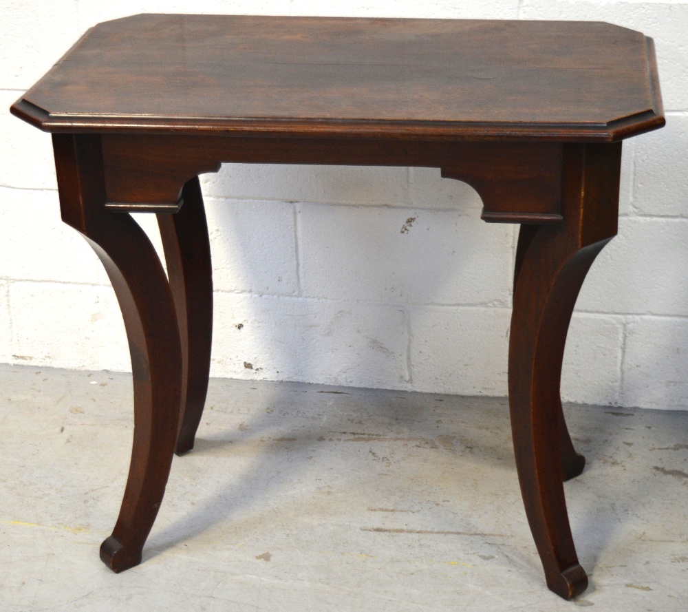 A mahogany Oriental style octagonal side table on curved supports, length 90cm.