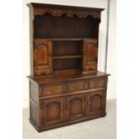 An oak reproduction Jacobean style dresser,