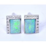 A pair of 18ct white gold opal and diamond cufflinks, approx 16.1g.