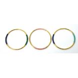 Three various 9ct yellow gold bangles, each with two coloured sections, approx combined 7.7g.