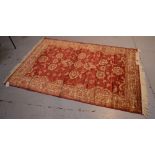 A red ground Ziegler rug, approx 190 x 140cm.