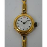 An 18ct yellow gold ladies' wristwatch, enamel dial set with Arabic numerals, Birmingham 1919,