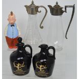 A collection of decanters and claret jugs to include two glass claret jugs,