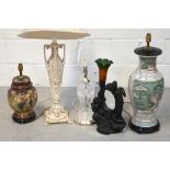 Seven lamps to include a baluster Oriental style lamp, two cut glass examples of varying sizes,