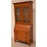 A 20th century mahogany bureau bookcase with stained glass inset doors, width 91cm.
