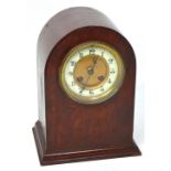 A 19th century mahogany eight day mantel clock, the dial set with Arabic numerals, French movement,