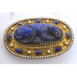 An unusual gilt metal framed lapis lazuli and pearl set brooch with cameo of a panther with diamond