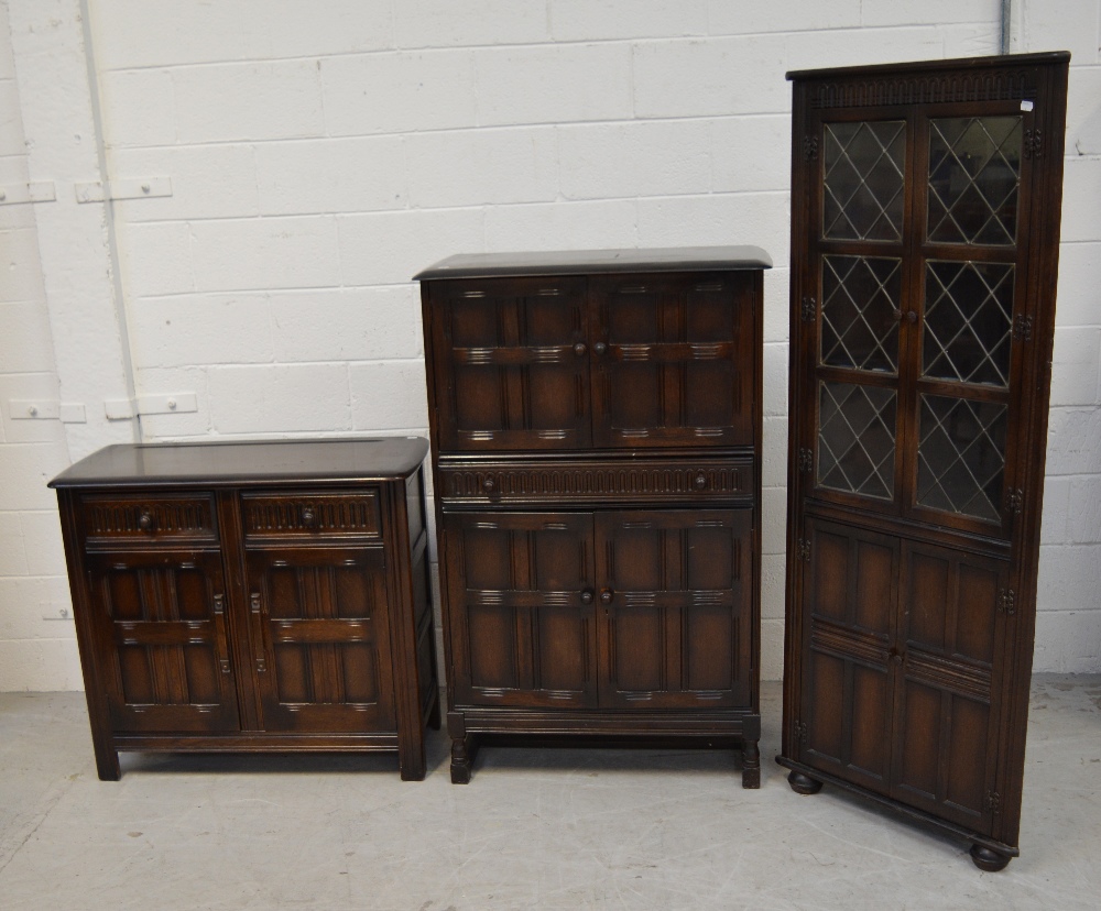 An Ercol style dining room suite comprising cocktail cabinet, width 83cm,