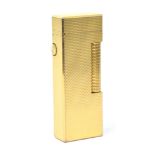 A gold plated Dunhill pocket lighter, unboxed.