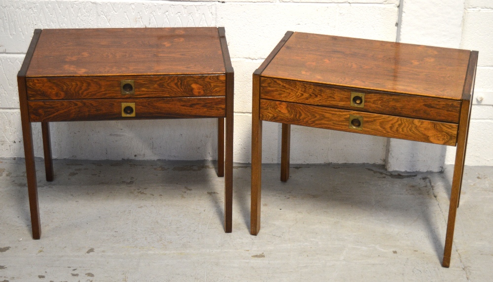 A pair of contemporary Oriental style two-drawer side tables on block supports (2).