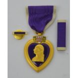 A boxed American WWII Purple Heart medal for military merit.