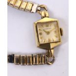 Longines; a 1940s ladies' cocktail watch, square gold filled case,