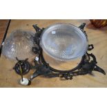 A 19th century French glass ceiling bowl in a bronze filigree frame,